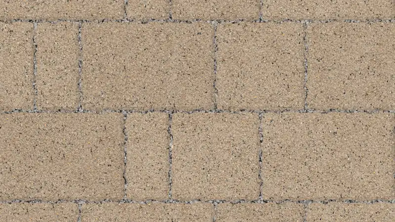 Oatmeal-colored textured block paving with a soft finish