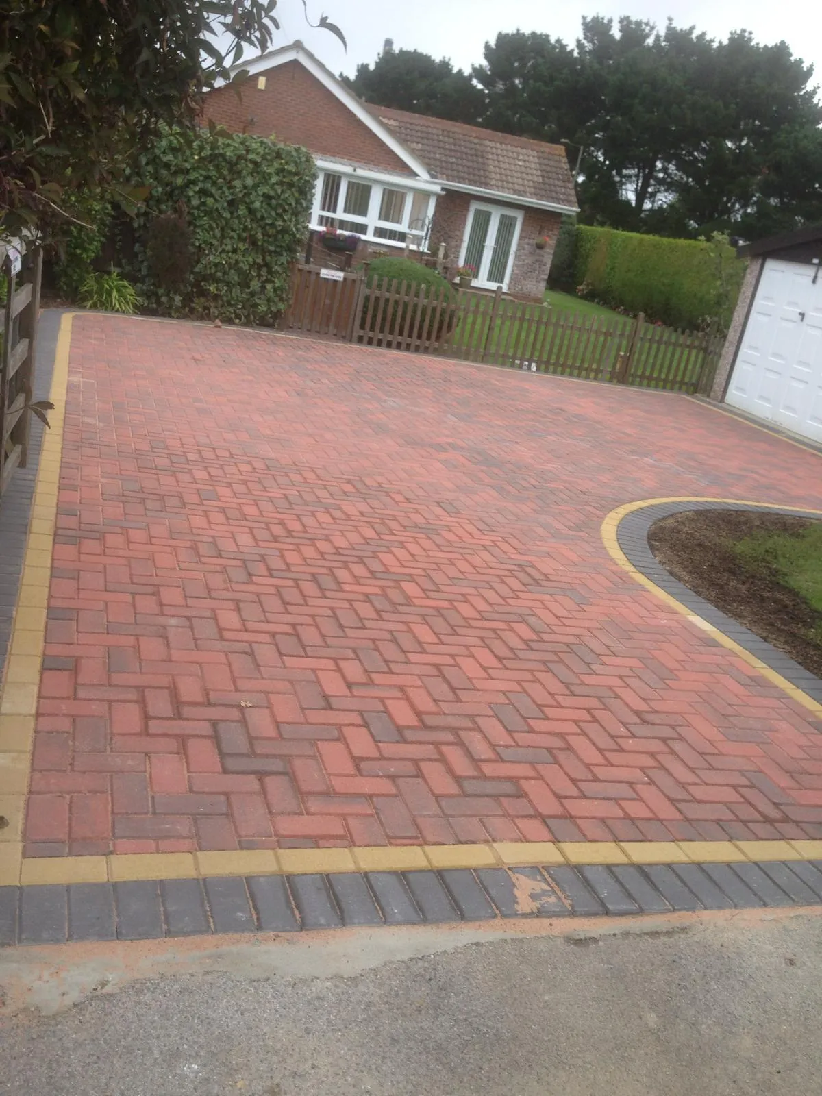 Block paving leading to a garage entrance