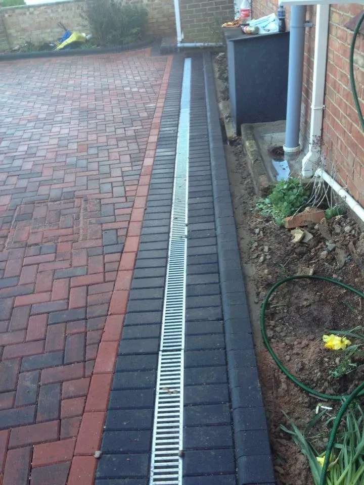 Installed drainage system for outdoor area