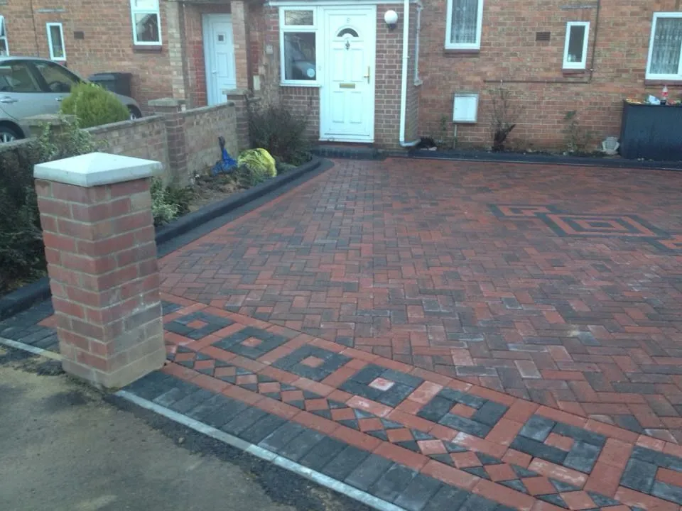 Charcoal and red block paving with post installation