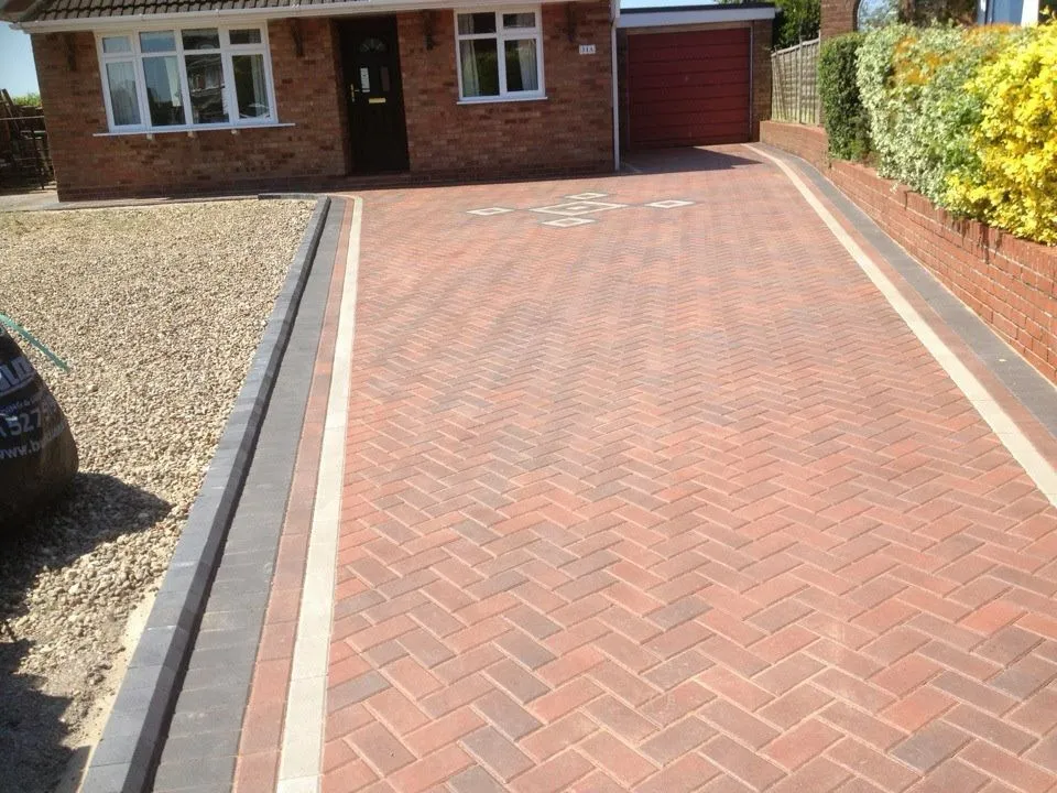 Red-themed block paving design for driveway